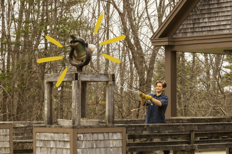 A staff member rings the Chewonki bell, signaling it's time for our community to gather.