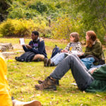 A student share their field journal during an outdoor science class